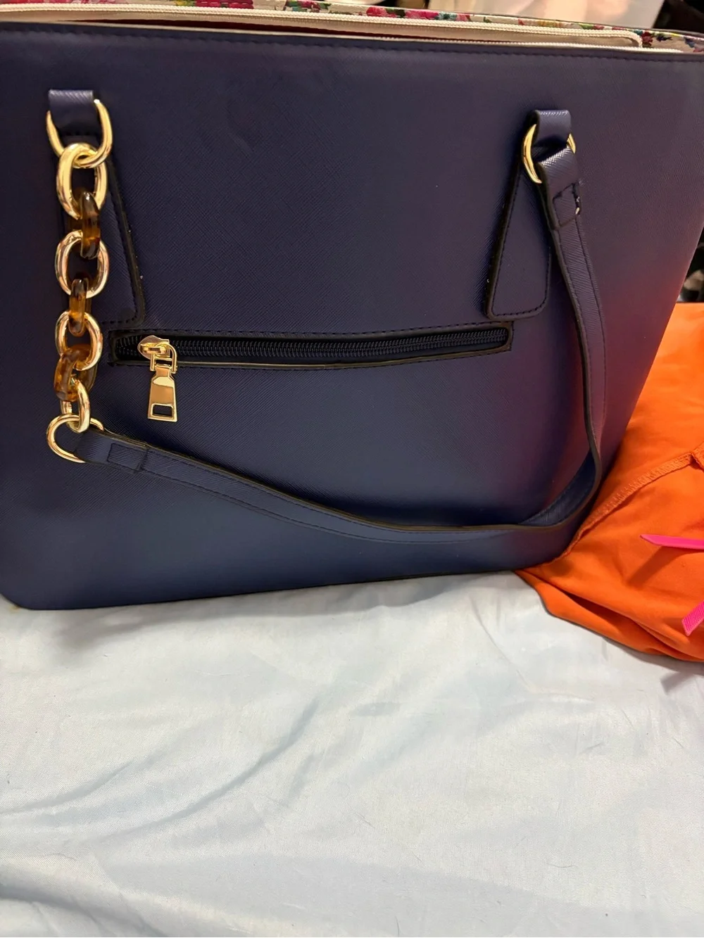Structured Navy Fashion Tote with Gold Chain Accent and Wallet.